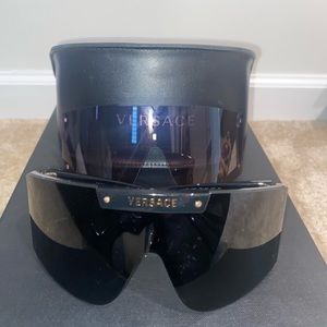 Versace sunglasses with extra lenses.